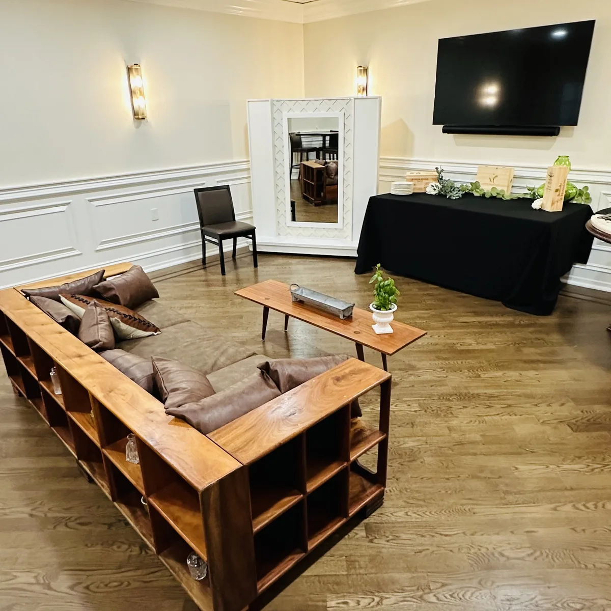 Private dining room lounge with TV display and gift table